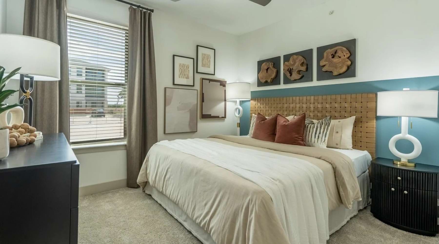 a bedroom with a bed and a dresser