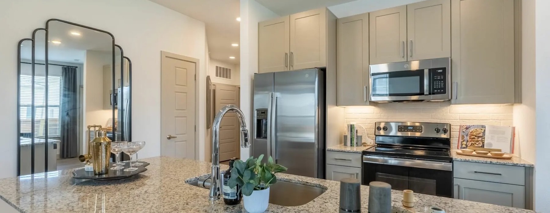 a kitchen with marble counters