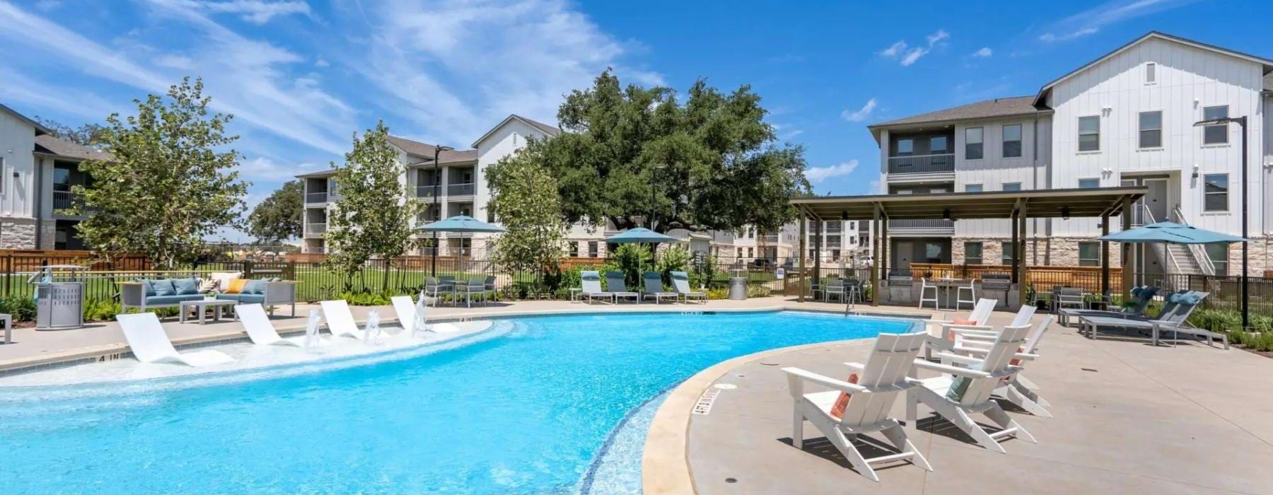 a swimming pool with chairs around it