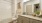 a bathroom with a tub sink and toilet